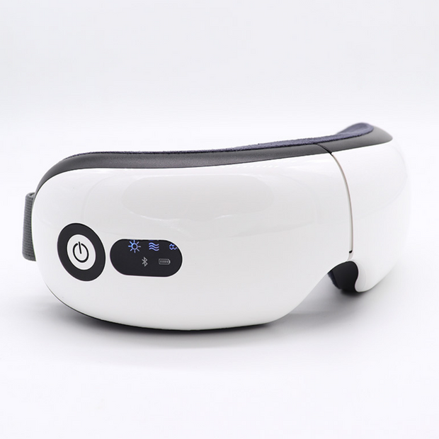 White eye massager with intelligent features and adjustable head band.